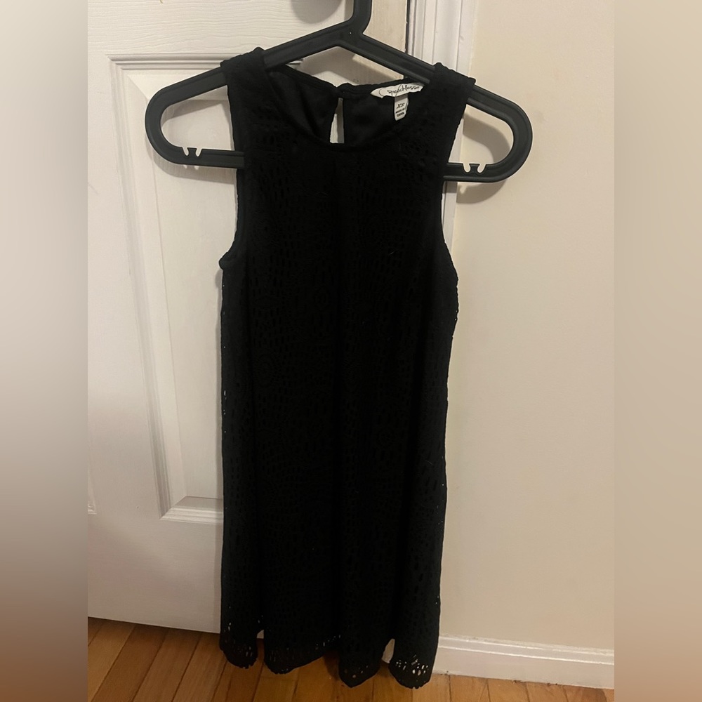 Black lacy dress with small circular cut out with button